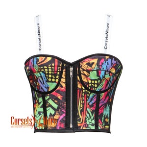 May include: A black and colorful corset with a zipper closure and adjustable straps. The straps have the text "CorsetsNMore" printed on them.