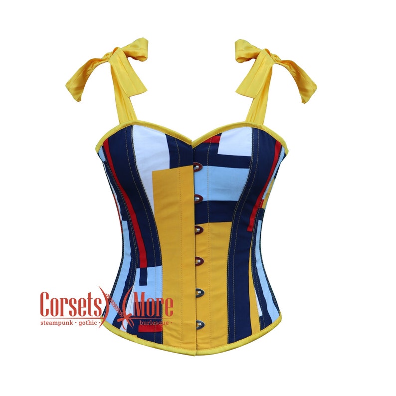 May include: A yellow, blue, red, and white striped corset with yellow straps and bows. The corset has a sweetheart neckline and is made of a cotton fabric. The corset is a type of undergarment that is worn to shape the body.