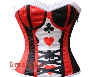 May include: A red and black corset with a white background featuring playing card symbols. The corset has a white lace trim and black ribbon lacing.