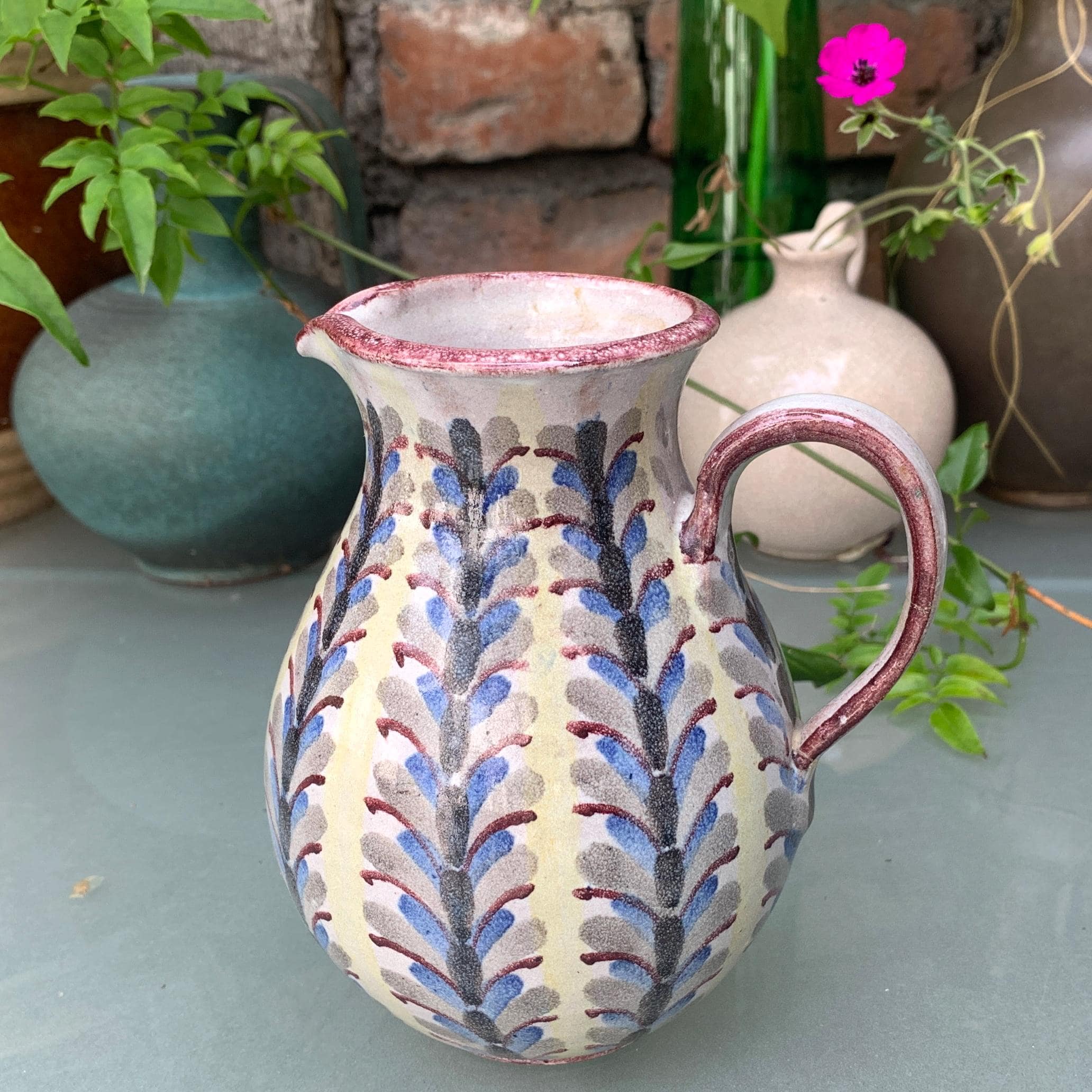 Vintage jug with blue pattern