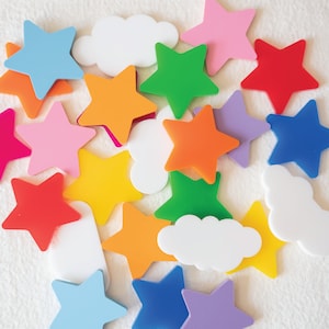 May include: A collection of colorful star-shaped and cloud-shaped decorations. The stars are in various colors, including red, orange, yellow, green, blue, pink, and purple. The clouds are white.