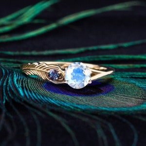 Blue feather engagement ring top