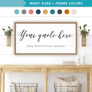 May include: A framed sign with a white background and a black handwritten quote that says "Your quote here" with the text "many font & color options" below the quote. The sign is hanging on a white shiplap wall.