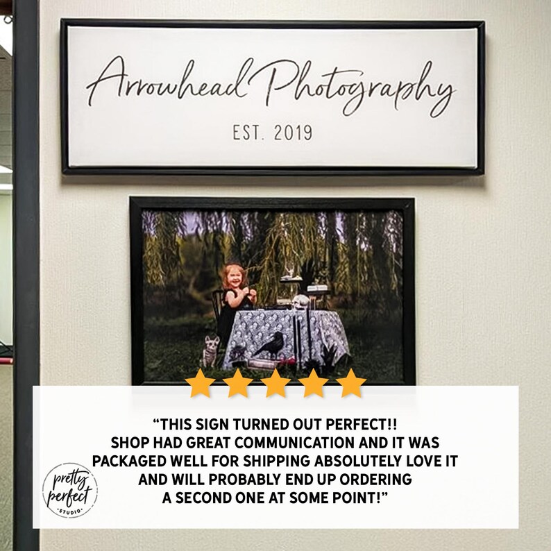 Business workspace with company signs displayed as custom indoor office wall art.
