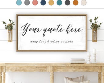 Puede incluir: Un letrero de pared rectangular con marco de madera clara que presenta el texto negro "Your quote here" en letra cursiva y "many font & color options" en fuente de máquina de escribir sobre fondo blanco, con muestras de color.