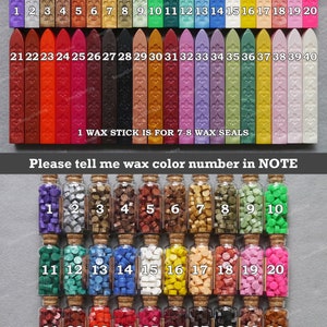 May include: A set of 40 wax sticks and 40 bottles of wax beads for sealing. The wax sticks are numbered 1-40 and the wax beads are numbered 1-40. The wax sticks are arranged in two rows of 20, and the wax beads are arranged in three rows of 13, with one row of 4. The wax sticks are in a variety of colors, including red, blue, green, gold, and silver. The wax beads are in a variety of colors, including red, blue, green, gold, and silver. The wax sticks are for 7-8 wax seals and the wax beads are for 18-20 wax seals. "Please tell me wax color number in NOTE" is written on the image.
