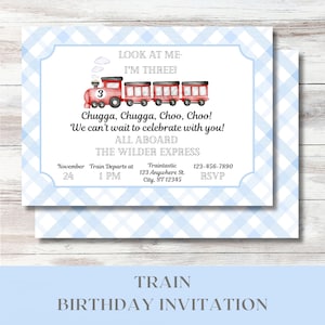 May include: A blue and white checkered invitation for a train-themed birthday party. The invitation features a red train with a number 3 on the front. The text on the invitation reads "Look at me - I'm three!" "Chugga, Chugga, Choo, Choo! We can't wait to celebrate with you!" "All Aboard The Wilder Express" "November 24 Train Departs at 1 PM" "Traintastic 123 Anywhere St. City, ST 12345" "123-456-7890 RSVP"
