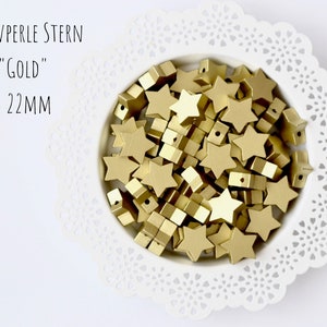 Motif beads star 22 mm in gold