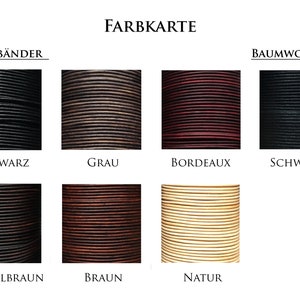 Könnte beinhalten: Farbkarte für Leder- und Baumwollbänder. Die Lederbandfarben umfassen Schwarz, Grau, Bordeaux, Dunkelbraun, Braun und Natur. Die Baumwollbandfarben umfassen Schwarz.