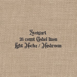 Może przedstawiać: Zbliżenie na beżową tkaninę lnianą z nadrukowanym tekstem "Zweigart 28 count Cashel linen Light Mocha / Mushroom".