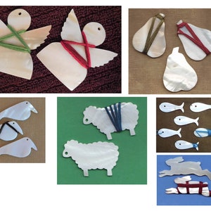 May include: A collection of white, pearl-like ornaments in various shapes, including angels, pears, sheep, fish, and rabbits. Each ornament is decorated with colorful yarn wrapped around it.