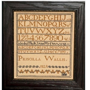 May include: Framed cross-stitch sampler featuring the name "Priscilla Wallis" and the year "1829". The sampler includes the alphabet, numbers, and decorative borders, all in brown thread on a beige background. The frame is dark brown.