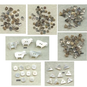May include: Assortment of white and brown mother of pearl buttons in various shapes, including oval, round, star, triangle, and sheep. The buttons are arranged in groups on a white background.