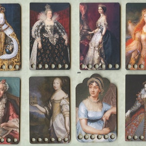 May include: Eight colorful cards with portraits of historical figures, each with a row of holes along the bottom. The cards are arranged in two rows of four.