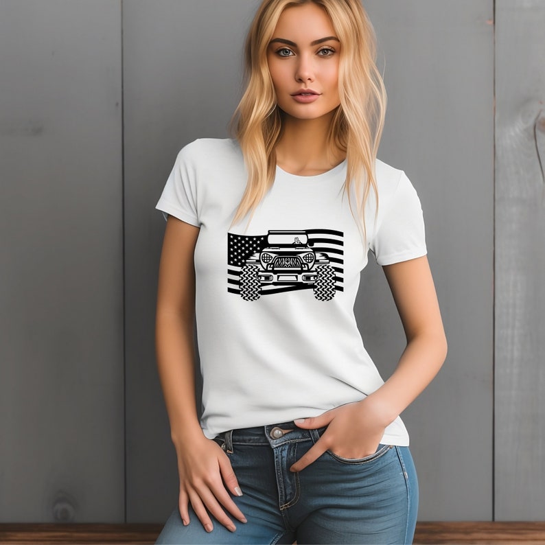 May include: White t-shirt featuring a black and white graphic of a Jeep in front of an American flag.