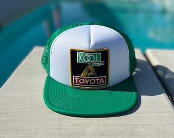 Vintage Kool Toyota Racing Patch on a White and Green Mesh Flat Brimmed Trucker Hat