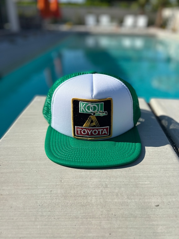 Vintage Kool Toyota Racing Patch on a White and Green Mesh Flat
