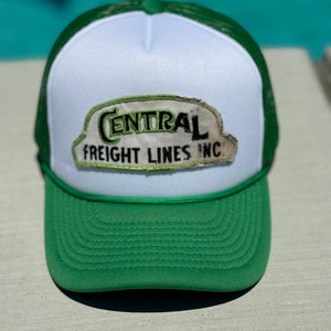 May include: A white and green trucker hat with a vintage "Central Freight Lines Inc." patch.