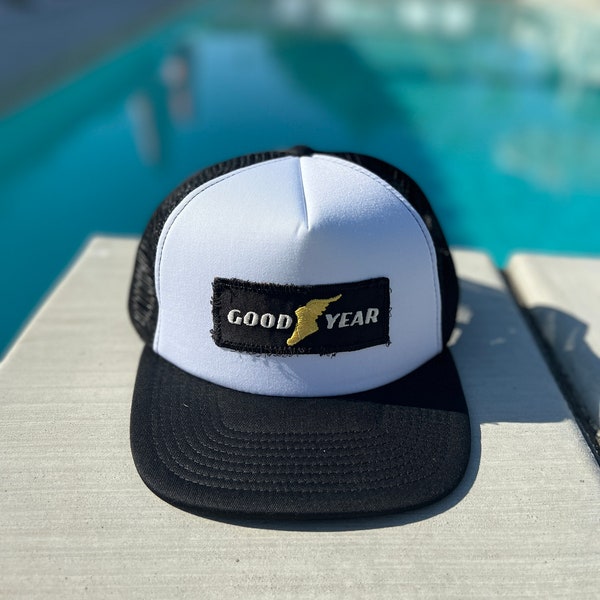 Vintage Goodyear Tire Logo Patch on a White and Black Mesh Trucker Hat