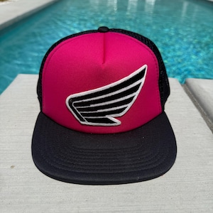 Vintage Honda Motorcycle Racing Logo Patch on a Pink and Black Mesh Trucker Hat