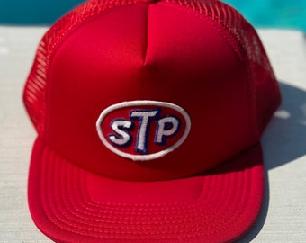 Vintage STP Logo Patch on a Red Mesh Trucker Hat