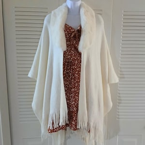 Womens Cream fringed Poncho with faux fur collar one size