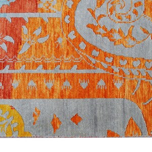 Hand-knotted wool Oushak rug in paisley pattern; rolled samples in teal, blue, orange for a textured floor decor rug.