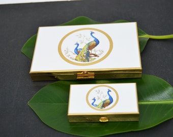 pitillera /tarjetero y pastillero vintage nuevo/ pavo real/de metal tono dorado/en sus cajas originales