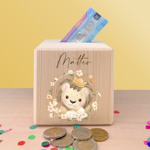 Personalized money box made of wood with safari animals personalized with name printed in color ideal as a gift for boys and girls