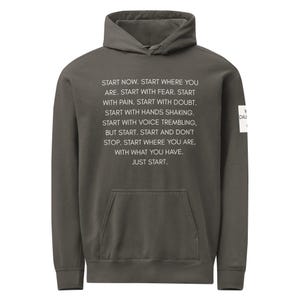 May include: A gray hoodie with a front pocket and a hood. The front of the hoodie features the text "START NOW. START WHERE YOU ARE...JUST START." A small white tag is on the right sleeve.