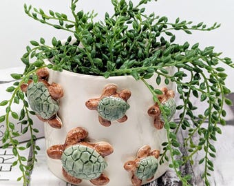 Keramische plantenbak met zwemschildpadden