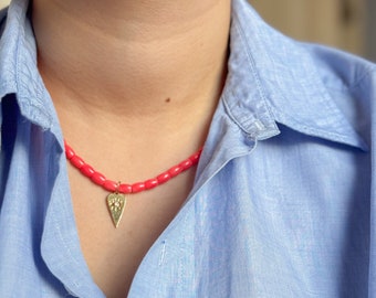 Coral necklace with heart shaped charm