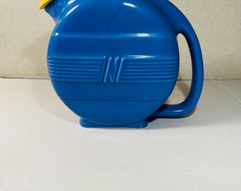 Bright Blue Pitcher With Yellow Cover Vintage by Norge.