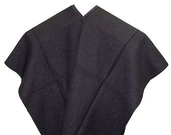 May include: A black wool poncho with fringe around the edges.