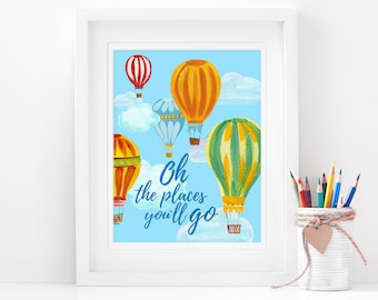 May include: A framed print with a blue background featuring colorful hot air balloons and the text "Oh the places you'll go".