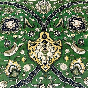 May include: A green rug with a floral pattern. The rug has a central design with a yellow and white flower. The rug is made of a soft, plush material.