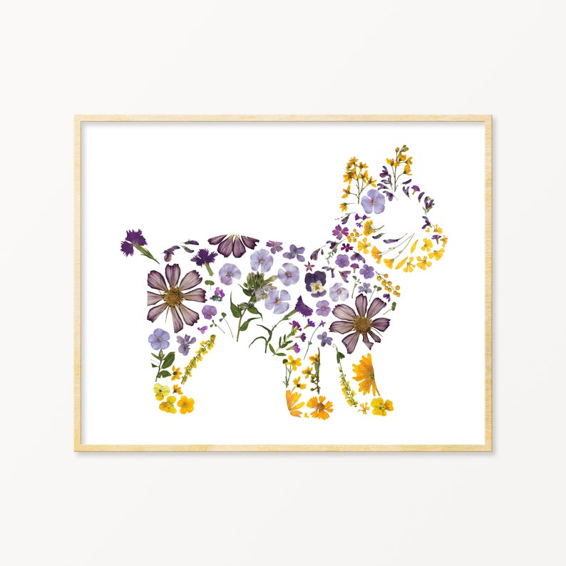 May include: A framed print of a dog silhouette made from pressed flowers. The dog is made from purple, yellow, and white flowers.