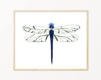 Peut inclure: Une peinture à l'aquarelle encadrée d'une libellule bleue aux ailes vertes sur fond blanc.