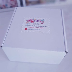 May include: White box with a sticker that says "Lili's Handmade Hair Accessories" with a floral design and the text "Etsy LiliMagicFlowers 0887 508 982".