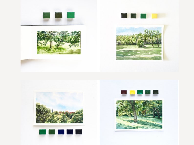 May include: Four watercolor landscape paintings displayed in a grid, each accompanied by small square paint pans in corresponding color palettes. The scenes depict lush green trees, grassy fields, and distant buildings under blue skies.