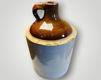 May include: A set of three ceramic mugs with a speckled, matte finish. The mugs are in shades of cream, light gray, and dark gray. Each mug has a simple, minimalist design, perfect for coffee or tea.