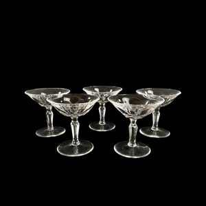 May include: Set of six clear glass champagne coupes with a decorative cut-glass pattern.