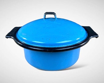 May include: A blue enamel pot with a black rim and a lid. The pot has a black handle on the lid.