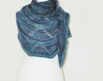 Hand knitted triangular shawl.