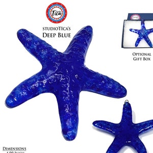 May include: A deep blue glass starfish ornament with a textured surface. The ornament is approximately 4 inches in size and weighs 2 ounces. It comes with a hook for hanging and is available in an optional gift box.