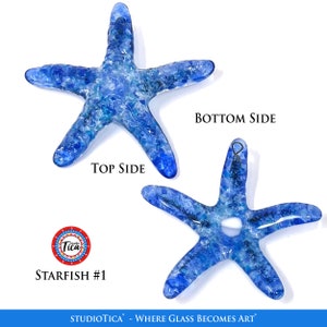 May include: Blue glass starfish ornament with a hole in the centre. The starfish is textured and has a white and blue marbled appearance. The text "STARFISH #1" is visible below the ornament.