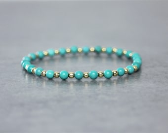 Women's bracelet in natural stones, turquoise beads and gold-plated beads