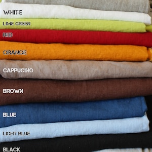 May include: A stack of 14 fabric swatches in various colors, including stripy, natural, white, lime green, red, orange, cappuccino, brown, blue, light blue, black, off-white, charcoal, and grey.