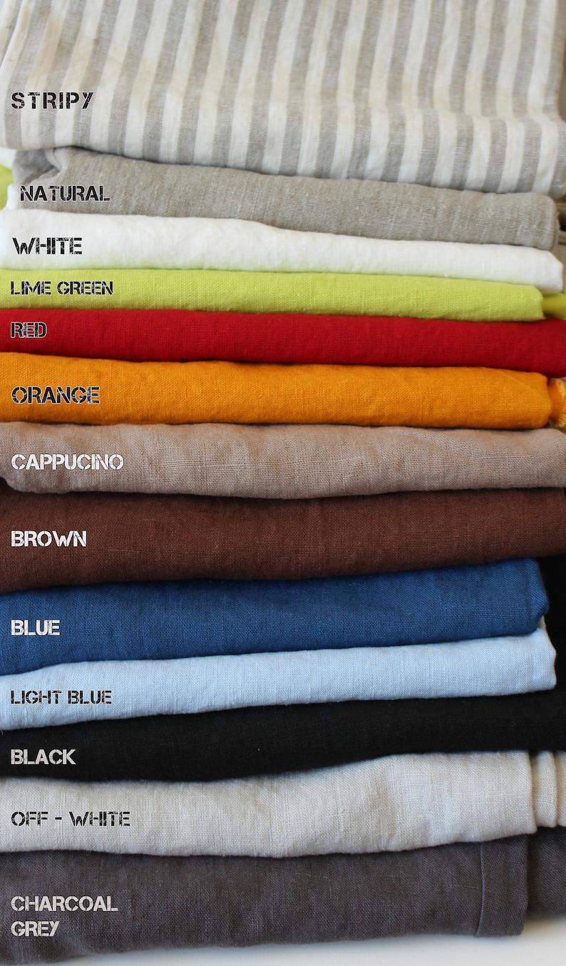 May include: A stack of 14 fabric swatches in various colors, including stripy, natural, white, lime green, red, orange, cappuccino, brown, blue, light blue, black, off-white, charcoal, and grey.