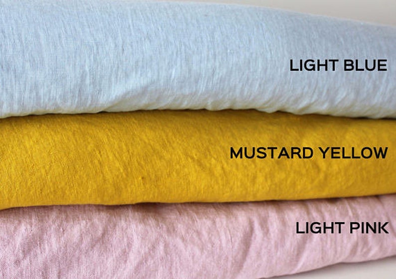 May include: Three fabric swatches stacked on top of each other. The top swatch is light blue, the middle swatch is mustard yellow, and the bottom swatch is light pink. The swatches are labeled "LIGHT BLUE", "MUSTARD YELLOW", and "LIGHT PINK".